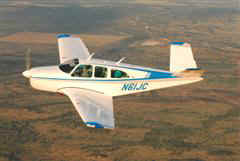 Close-up photo of Beechcraft P-35 Bonanza N61JC in air