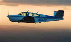 N61JC in flight at sunset